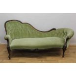 Victorian walnut framed chaise longue, with green button upholstery and carved showwood frame on cab