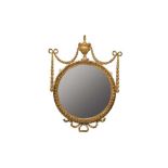 Pair of Adams-style circular gilt gesso wall mirrors, each with circular plates in egg and dart fram