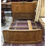 Art Deco burr elm and tulipwood crossbanded single bed, the arched headboard with gilt metal crestin