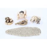 19th century pieced ivory plaque, and four Japanese carved ivory netsuke