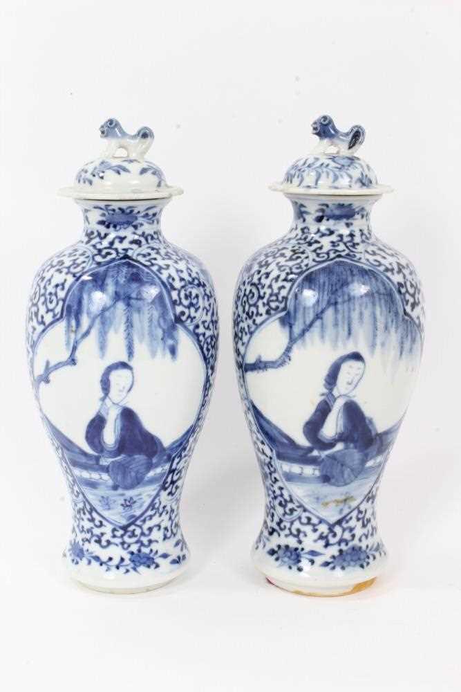 Pair 19th century Chinese blue and white porcelain baluster vases and cover, decorated with figural