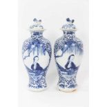 Pair 19th century Chinese blue and white porcelain baluster vases and cover, decorated with figural