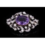 Late Victorian amethyst and diamond brooch with a central oval mixed cut amethyst measuring approxim