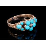 Regency gold and turquoise forget-me-not ring with a central diamond chip surrounded by turquoise pe
