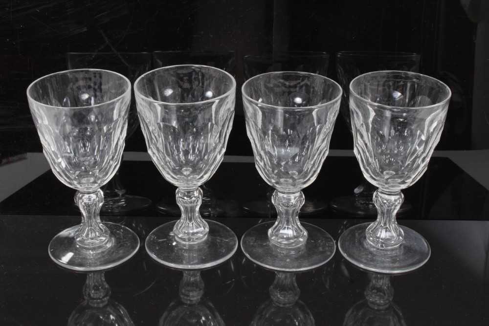 Set of four antique Georgian cut glass goblets, with facet-cut round funnel bowls, and facet-cut wai