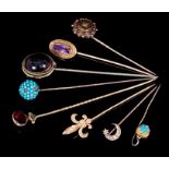 Group of eight antique gem-set stick pins to include 14k gold and seed pearl fleur de lys stick pin