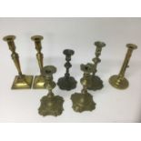 Pair of George I / II brass candlesticks, together with two similar sticks and two later