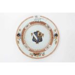 Good quality 18th century Chinese famille rose armorial porcelain dish, the centre painted with coat