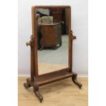 Victorian mahogany cheval mirror, arched mirrored swing plate on finialled supports and sledge base