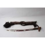 Early 20th century Borneo Dayak Mandau head hunters sword with carved bone and hair bound hilt,