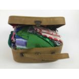 Vintage vanity case containing a quantity of vintage scarves.