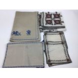 A quantity of table linens including embroidered cloths, various lace mats including Maltese, Tape,
