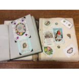 Two albums of Victorian greeting cards, paper lace, silks, pop-ups etc