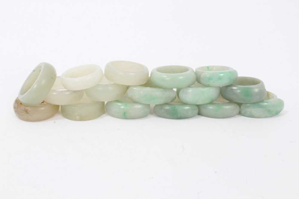 Collection of 16 Chinese polished green hard stone/ jade rings