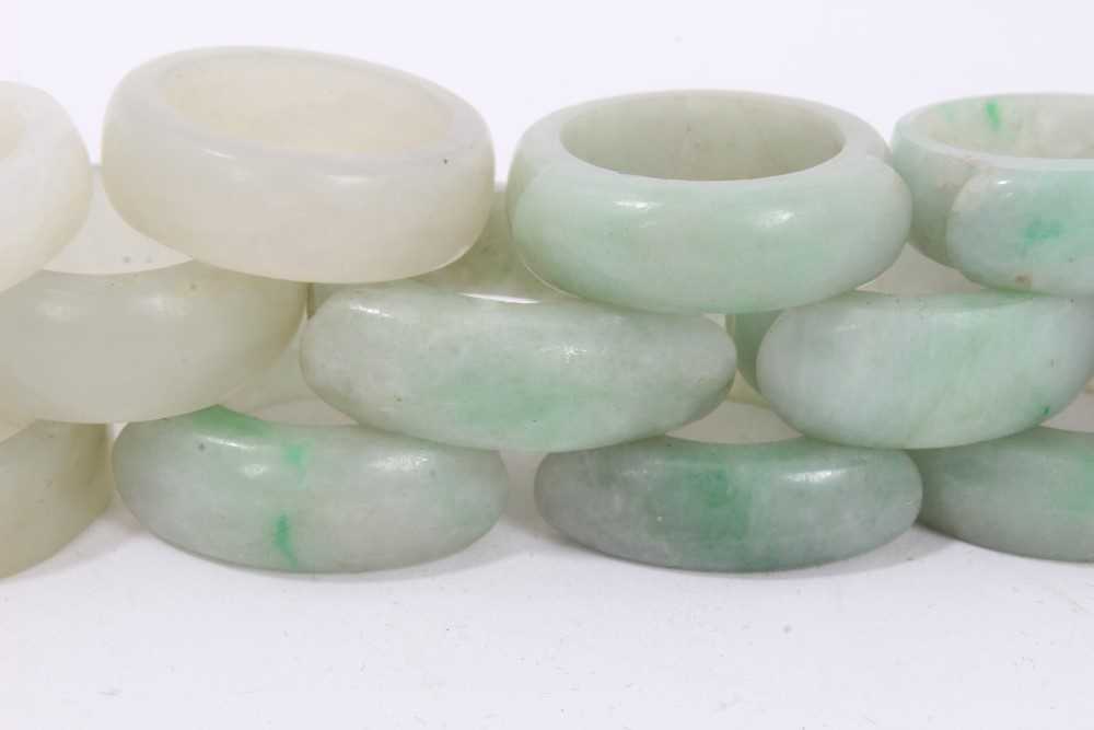 Collection of 16 Chinese polished green hard stone/ jade rings - Image 3 of 5