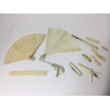 Two carved ivory fans, various other ivory and bone works of art