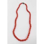 Old Chinese coral necklace with barrel shaped polished beads and oval silver clasp with wire work fl