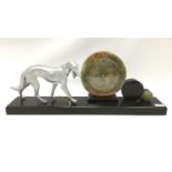 Large Art Deco style black marble and onyx clock mounted with a metal dog, 70.5cm width