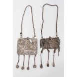 Two Old Chinese white metal necklaces with embossed plaque depicting a figure on a dragon/horse