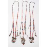 Three old Chinese coral bead necklaces with white metal horse pendants