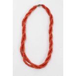 Old Chinese coral three stand rope twist necklace with silver gilt clasp, 54cm long