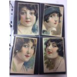 Postcards in album including Art Nouveau glamour artist drawn cards by H. Cherubini, B. Patella and