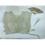 An Edwardian sleeveless cropped lace blouse, small lace collars and cuffs, lace lengths, a quantity