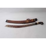 Two Early 20th century Borneo Parang swords, one with horn and bone hilt , heavy curved blade in hor