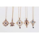 Five Edwardian 9ct gold gem set open work pendants on 9ct gold chains