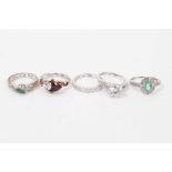 10k white gold green stone and diamond ring, together with four silver gem set dress rings