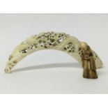 Ornate 19th century Chinese carved ivory tusk section, together with a Chinese carved ivory deity fi