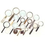 Box of antique and vintage magnifying glasses, including two silver-handled examples