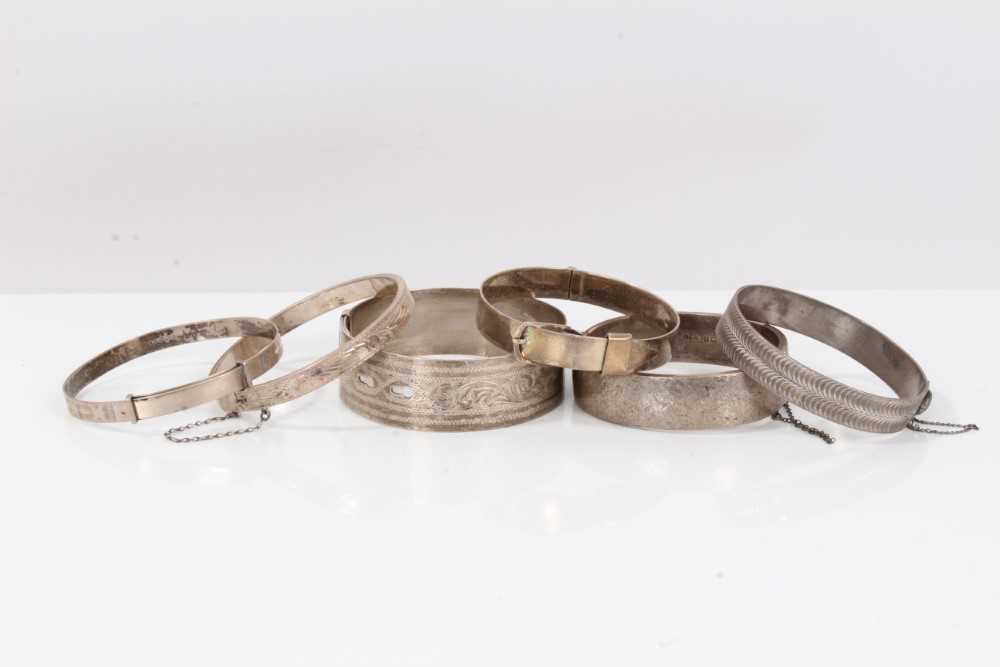 Six silver bangles