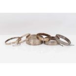 Six silver bangles