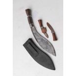 Gurkha Kukri with steel blade, in brown leather covered sheath, 33cm in overall length, blade 22.5cm