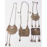 Four Old Chinese white metal necklaces with embossed plaques depicting figures, dragons and flowers