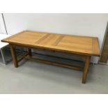 Large oak extending kitchen table with two extra leaves on square taper legs
