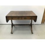 Regency style mahogany sofa table, hinged crossbanded top with reeded edge and two frieze drawers on