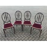 Four Edwardian mahogany dining chairs with red upholstered seats