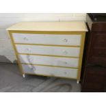 Painted chest of four long drawers on turned legs