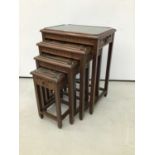 Chinese carved wooden nest of three coffee tables