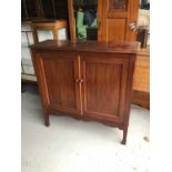 Edwardian mahogany cupboard enclosed by two panelled doors on turned legs, 107cm wide x 106cm high x