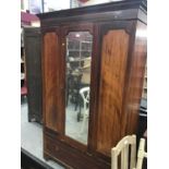 Edwardian walnut wardrobe with mirrored glass door