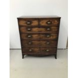 George III mahogany chest of two short and four long graduated drawers with later brass cup handles
