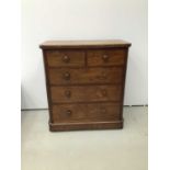 Victorian mahogany chest of two short and three long graduated drawers with turned bun handles, on b