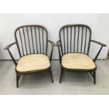 Pair of Ercol elbow chairs together with a small low back side chair