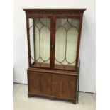 Good quality George III-style mahogany two height display cabinet, the top enclosed by gothic astrag