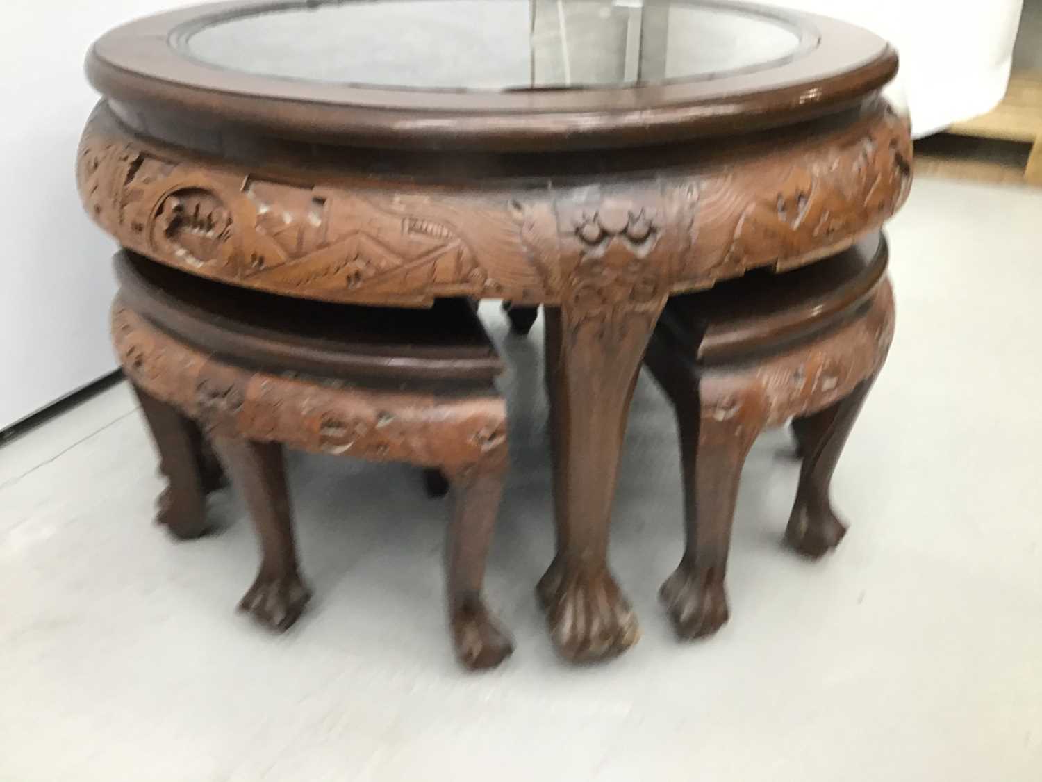 Chinese circular carved coffee table with integral nest of tables - Image 3 of 4