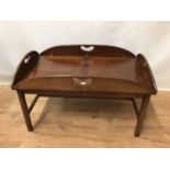 Campaign style mahogany folding tray topped coffee table