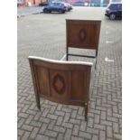 Edwardian inlaid mahogany single bedstead with inlaid panels and original side iron